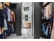 Bright walk-in closet with built-in storage and a view to the bathroom at 261 Ormond Se St, Atlanta, GA 30315