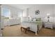 Light and bright primary bedroom featuring plush carpet and large windows at 326 Roswell Se St # 706, Marietta, GA 30060
