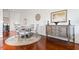 Elegant dining area featuring a round table, matching chairs, and a decorative sideboard for stylish meals at 326 Roswell Se St # 706, Marietta, GA 30060