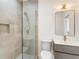 Modern bathroom features a glass enclosed shower and sleek vanity with modern fixtures at 3711 Mountain Cove Rd, Snellville, GA 30039