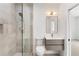 Modern bathroom features a glass enclosed shower and sleek vanity with modern fixtures at 3711 Mountain Cove Rd, Snellville, GA 30039