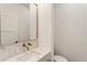 Bathroom features a white marble sink, gold faucet, and a geometric tile backsplash at 3711 Mountain Cove Rd, Snellville, GA 30039