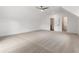 Large carpeted bedroom with an open door to the ensuite bathroom at 3711 Mountain Cove Rd, Snellville, GA 30039