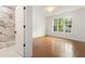 Spacious bedroom with an en suite bathroom features hardwood floors and lots of natural light at 3711 Mountain Cove Rd, Snellville, GA 30039
