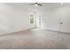 Bright, spacious bedroom with neutral carpet, ceiling fan, and natural light at 3711 Mountain Cove Rd, Snellville, GA 30039