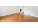 Spacious bedroom with hardwood floors and neutral paint color at 3711 Mountain Cove Rd, Snellville, GA 30039