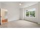 Bright and spacious carpeted bedroom with large windows at 3711 Mountain Cove Rd, Snellville, GA 30039