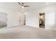 Bright and airy bedroom with carpet, complemented by an en suite bathroom and multiple doorways at 3711 Mountain Cove Rd, Snellville, GA 30039
