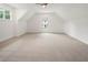 Large upstairs bonus room with carpet, great natural light, and high ceilings at 3711 Mountain Cove Rd, Snellville, GA 30039