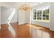 Bright dining room with hardwood floors and ample natural light at 3711 Mountain Cove Rd, Snellville, GA 30039
