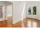 Open foyer with wood floors and double doors with natural light from the outside at 3711 Mountain Cove Rd, Snellville, GA 30039