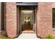 Charming brick home featuring a covered entryway with recessed lighting at 3711 Mountain Cove Rd, Snellville, GA 30039