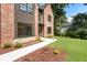 Beautiful brick house featuring a landscaped front yard and a concrete walkway at 3711 Mountain Cove Rd, Snellville, GA 30039