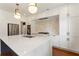 Bright kitchen features an island with seating, stainless appliances, and modern fixtures at 3711 Mountain Cove Rd, Snellville, GA 30039