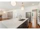 Open concept kitchen features an island with seating and stainless steel appliances at 3711 Mountain Cove Rd, Snellville, GA 30039