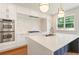 Well-equipped kitchen features double ovens, an island with seating, and a modern backsplash at 3711 Mountain Cove Rd, Snellville, GA 30039