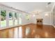 Inviting living room featuring hardwood floors, a stone fireplace, recessed lighting, and French doors at 3711 Mountain Cove Rd, Snellville, GA 30039