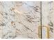 Elegant bathroom with marble tile, modern shower fixtures, and a glass door at 3711 Mountain Cove Rd, Snellville, GA 30039