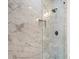 Shower featuring beautiful marble tile and modern shower head at 3711 Mountain Cove Rd, Snellville, GA 30039