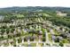 A scenic aerial of homes surrounded by mature trees and a distant mountain landscape at 5420 Stevehaven Ln, Cumming, GA 30028