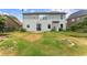 View of the home's level backyard, perfect for outdoor activities and entertaining, accessible through a glass door at 5420 Stevehaven Ln, Cumming, GA 30028