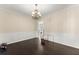 Elegant dining room featuring hardwood floors, chandelier lighting, and wainscoting details at 5420 Stevehaven Ln, Cumming, GA 30028