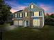 Charming two-story home featuring a stone facade, two-car garage, manicured lawn, and classic curb appeal at 5420 Stevehaven Ln, Cumming, GA 30028