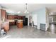 Spacious kitchen featuring wood cabinets, an island, and stainless steel appliances, flowing into dining space at 5420 Stevehaven Ln, Cumming, GA 30028
