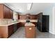 Spacious kitchen with wood cabinets, stainless steel appliances, and center island for extra space at 5420 Stevehaven Ln, Cumming, GA 30028