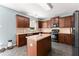 Well-equipped kitchen features an island, stainless steel appliances, and plenty of cabinet space at 5420 Stevehaven Ln, Cumming, GA 30028