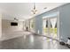 Open-concept living room featuring a fireplace, doors to the backyard, and views to the kitchen at 5420 Stevehaven Ln, Cumming, GA 30028