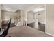 View of open living room with hardwood floors, staircase, chandelier, and great natural light at 5420 Stevehaven Ln, Cumming, GA 30028