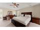 Spacious main bedroom featuring a large bed, carpet, and natural lighting at 5420 Stevehaven Ln, Cumming, GA 30028
