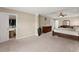 Spacious primary bedroom featuring a tray ceiling, walk-in closet, and ensuite bathroom at 5420 Stevehaven Ln, Cumming, GA 30028