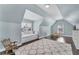 Comfortable bedroom space with daybed, hardwood floors and plush rug with plenty of natural light at 6630 Club Valley Ct, Suwanee, GA 30024