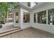 Expansive deck offers outdoor entertaining with views into the house, including stairs and chandelier at 6630 Club Valley Ct, Suwanee, GA 30024
