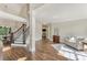 Inviting foyer with hardwood floors, elegant staircase, and bright natural light at 6630 Club Valley Ct, Suwanee, GA 30024
