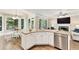 Open-concept kitchen with stainless appliances, a large island, and access to the living room at 6630 Club Valley Ct, Suwanee, GA 30024