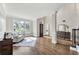 Bright living room features hardwood floors, elegant columns, and a grand front door at 6630 Club Valley Ct, Suwanee, GA 30024