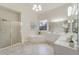 Serene main bathroom featuring a soaking tub, separate shower, and dual vanities at 6630 Club Valley Ct, Suwanee, GA 30024
