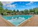 Inviting community pool featuring clear blue waters and ample seating, perfect for relaxation at 6630 Club Valley Ct, Suwanee, GA 30024