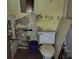 Small bathroom with dated toilet and sink; awaits needed repair and updates at 1159 Eastridge Sw Rd, Atlanta, GA 30311