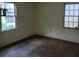 Modest bedroom offering hardwood flooring and two windows for natural lighting, awaits personal touches at 1159 Eastridge Sw Rd, Atlanta, GA 30311