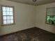 Bedroom with hardwood floors and two sunny windows ready to be transformed at 1159 Eastridge Sw Rd, Atlanta, GA 30311