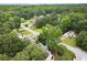An aerial view of a neighborhood featuring mature trees and well-maintained homes at 1418 Mill Path Loop, Lawrenceville, GA 30045