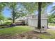 Beautifully maintained backyard with a patio, deck, and mature trees, creating a serene outdoor space at 1418 Mill Path Loop, Lawrenceville, GA 30045