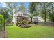 Expansive backyard featuring lush greenery and deck, perfect for outdoor enjoyment and relaxation at 1418 Mill Path Loop, Lawrenceville, GA 30045