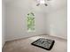 Bedroom with a ceiling fan and large window providing abundant light at 1418 Mill Path Loop, Lawrenceville, GA 30045