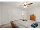 Bedroom featuring double closets and a ceiling fan at 1418 Mill Path Loop, Lawrenceville, GA 30045