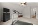Bright bonus room features a treadmill, a TV, and a closet. Great for exercising at 1418 Mill Path Loop, Lawrenceville, GA 30045